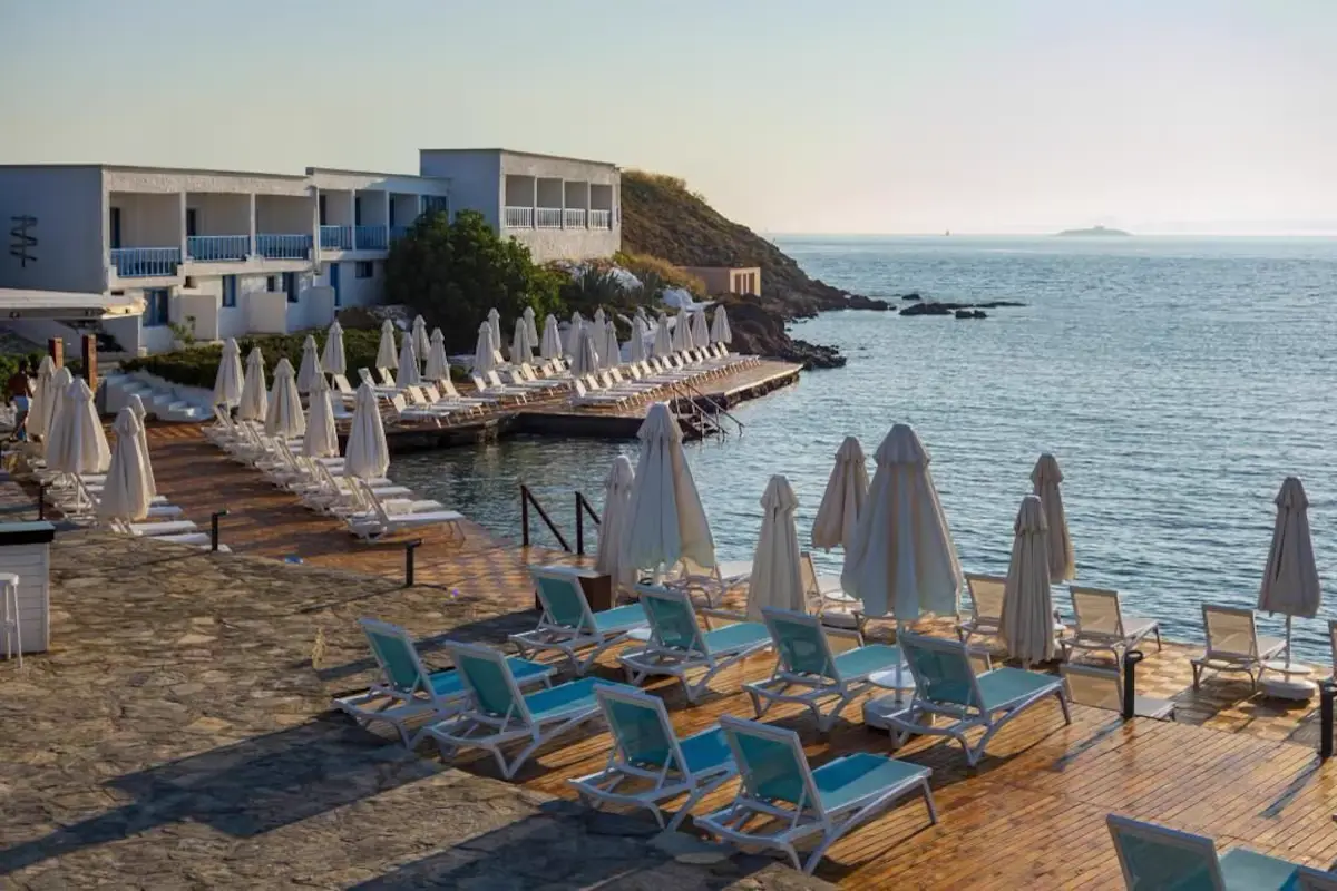Sun loungers and parasols on the seafront terraces of Pelagos Otel Bozcaada